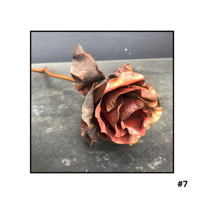 Handcrafted copper rose sculpture #7 with layered petals in coral and bronze tones on white background