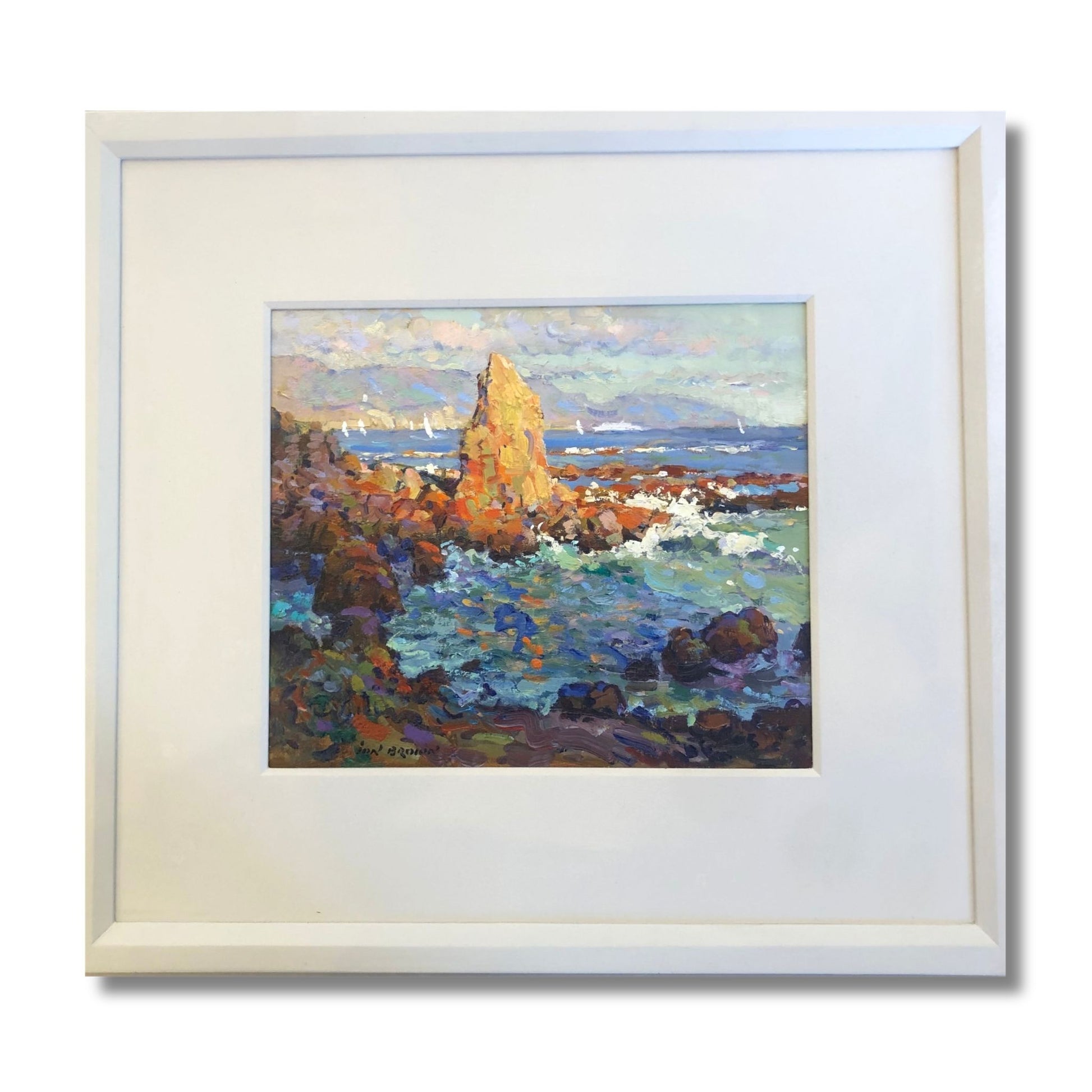 Framed original oil on board coastal painting of a golden rock stack and churning teal sea with sailboats by Ion Brown, framed 59 x 54cm, titled Evening Light Wellington
