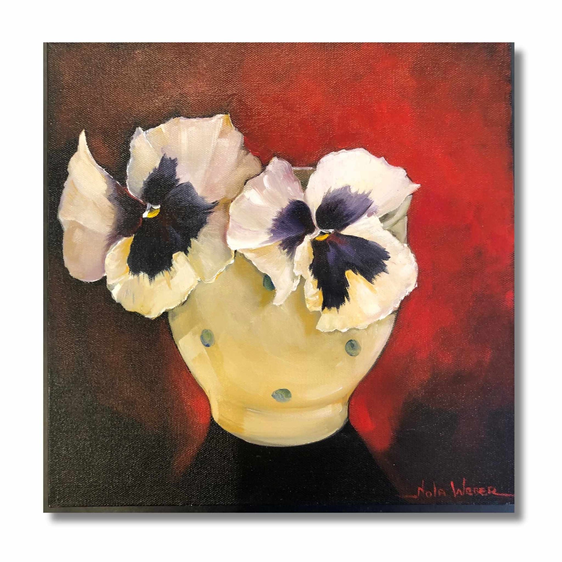 Original oil painting of two white pansies with dark centres in a yellow polka-dot bowl against a deep red background, by New Zealand artist Nola Weber, 30 × 30cm.