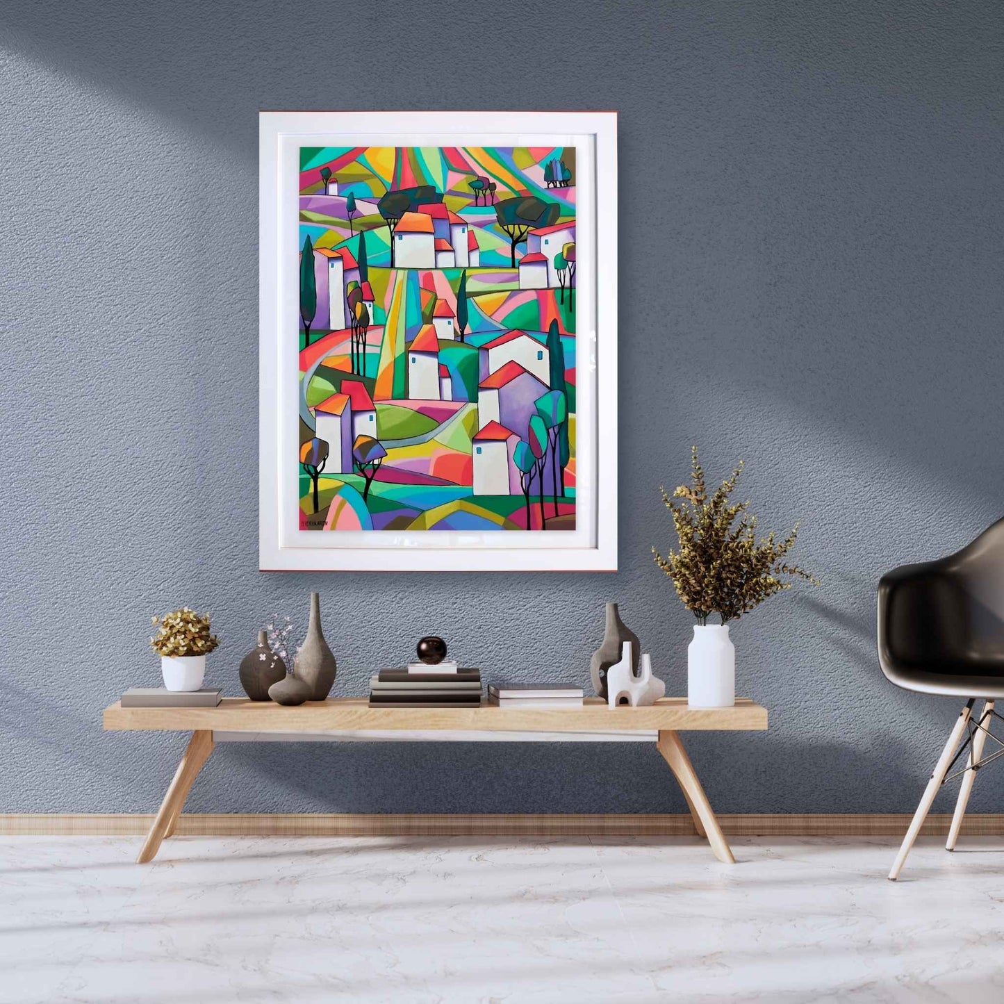 Colorful abstract painting on a gray wall above a wooden console table with decorative items.