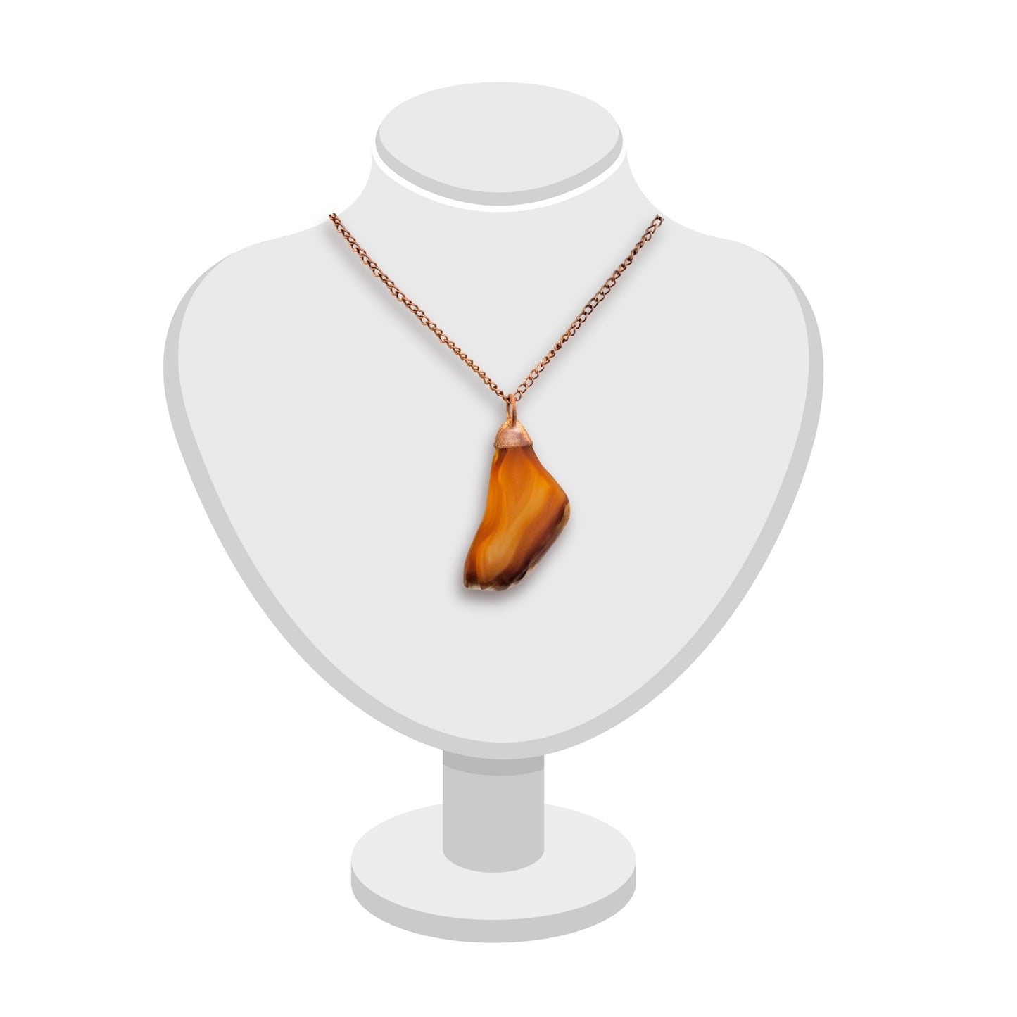Carnelian agate pendant in warm amber tones with copper bail by Gary Howse, shown on a jewellery bust.