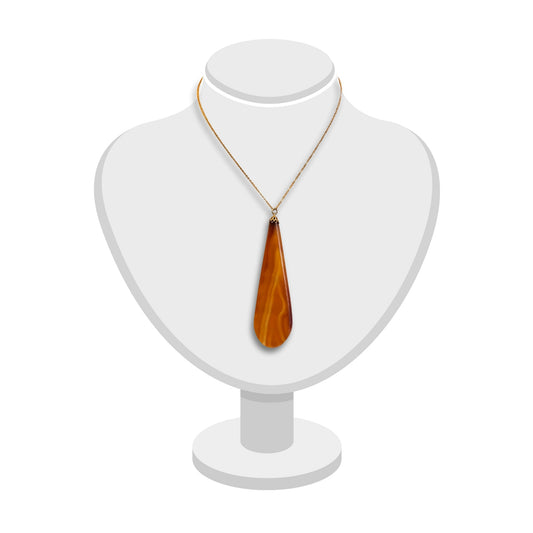 Long tapered carnelian pendant with gold chain displayed on a white bust.