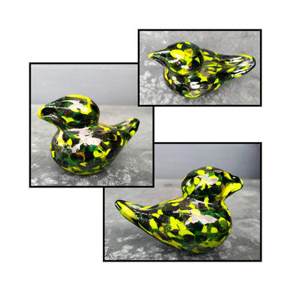 Handblown green, lime spotted glass bird by Heather Kremen with smooth curves and glossy finish