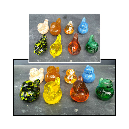 Assorted handblown glass birds by Heather Kremen in vibrant, one-of-a-kind colours.

