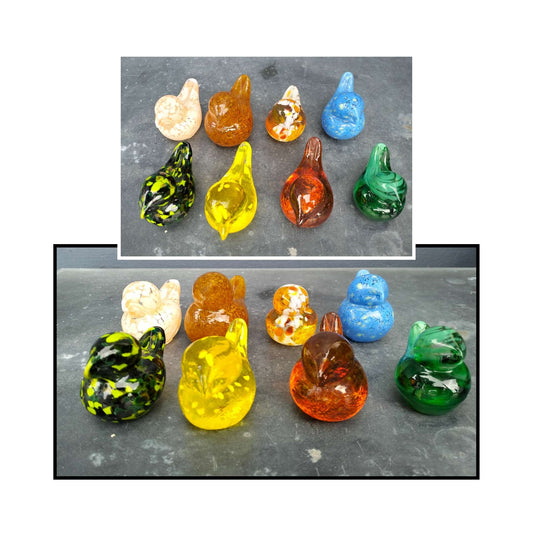 Assorted handblown glass birds by Heather Kremen in vibrant, one-of-a-kind colours.

