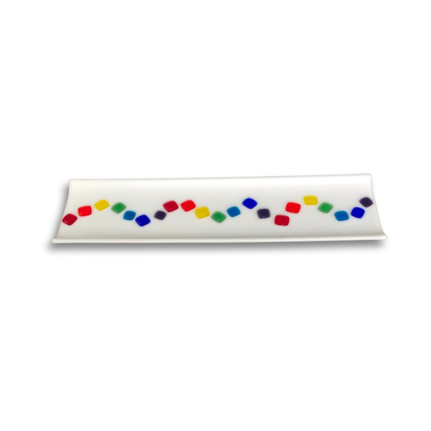 Rectangular opaque white fused glass sushi tray with a central wave of colourful squares, handcrafted by Jill Matthew on whaite


