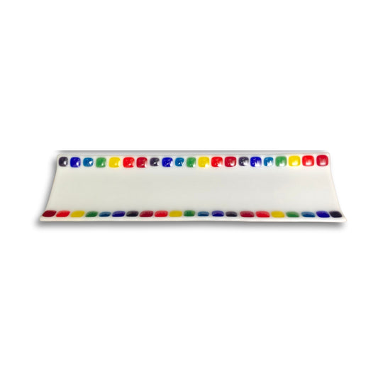 Rectangular opaque white fused glass sushi tray with colourful squares along each side, handcrafted by Jill Matthew.