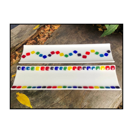 Rectangular opaque white fused glass sushi trays with colourful squares along each side  on one and down the middle on the other 