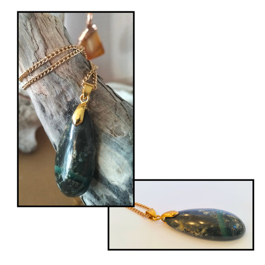 Greenstone teardrop pendant by Gary Howse — deep teal-green polished stone with pale greenstone stripe, gold bale and chain, shown draped over driftwood and close-up detail
