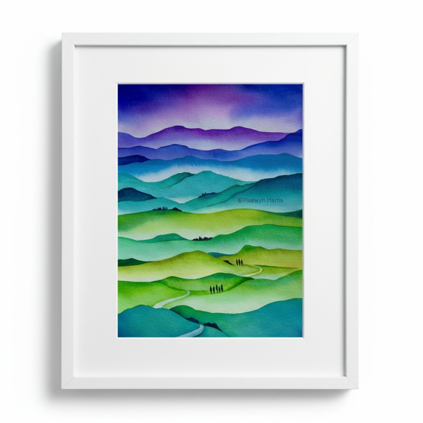 Hills in Harmony - watercolor painting by Raewyn Harris featuring layered rolling hills in vibrant greens, teals, purples and blues with small tree silhouettes, displayed in white mat and white frame