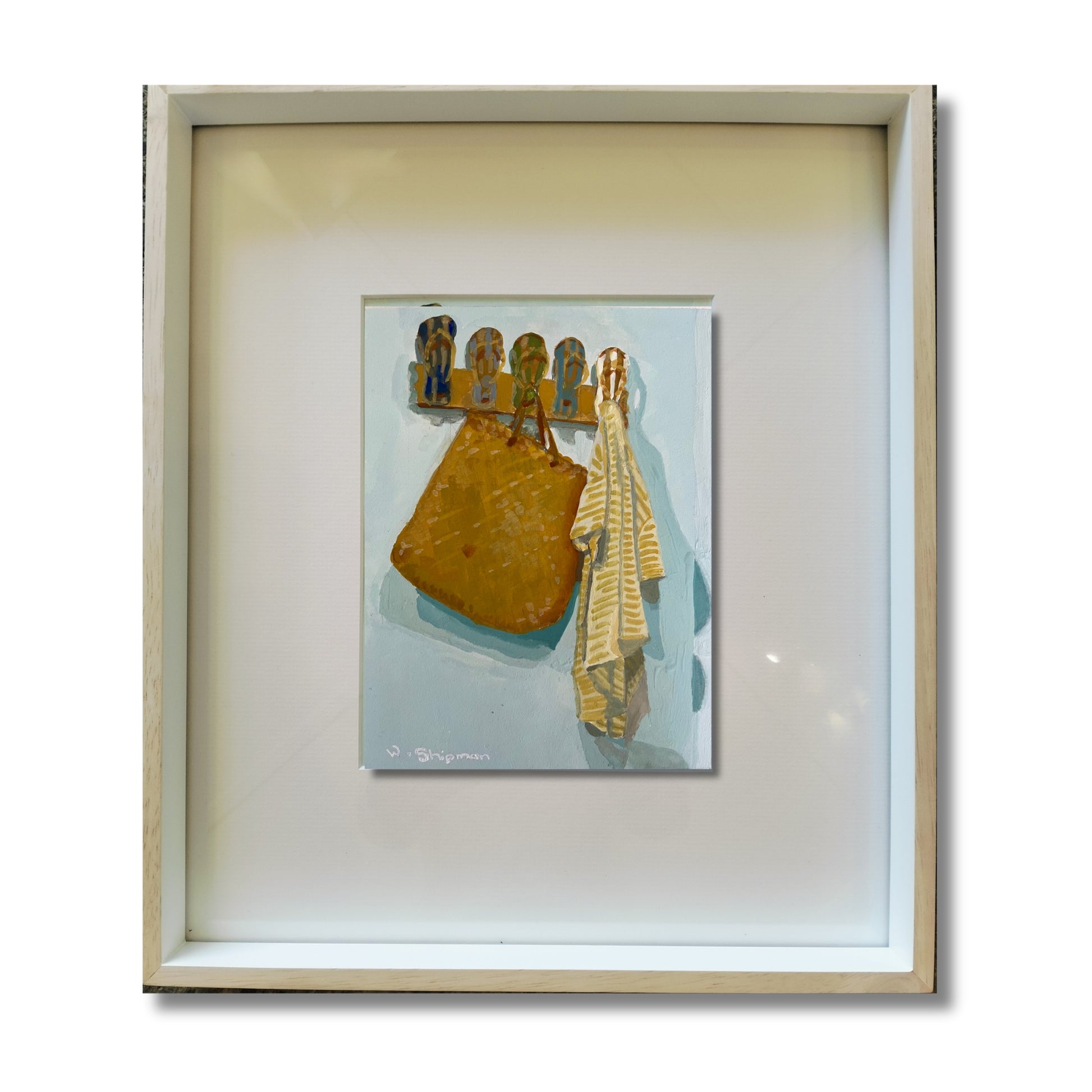 Gouache painting of a golden kete bag and striped towel on jandal hooks, pale blue-green background, framed, on a white background 
by NZ artist Wendy Shipman
