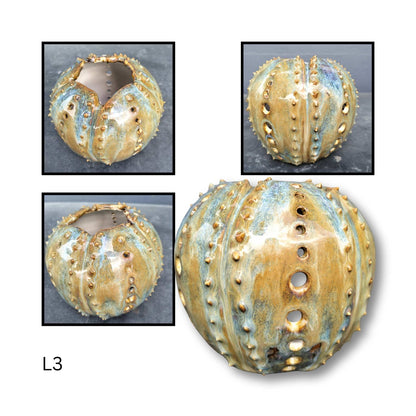 Decorative ceramic sphere with textured surface on a white background