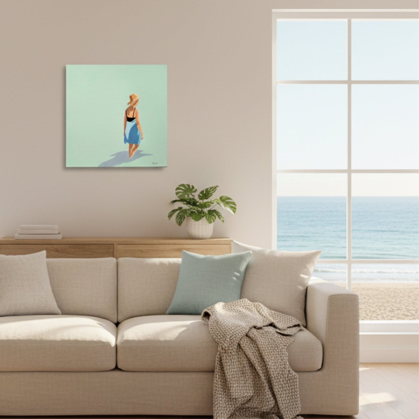 Living room with a beige sofa, light blue pillow, and a painting of a woman on a green wall.