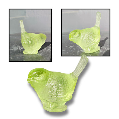 Small cast glass bird sculpture in lime green with tail up by Lou Mathieson, 5x4x5cm, on white background
