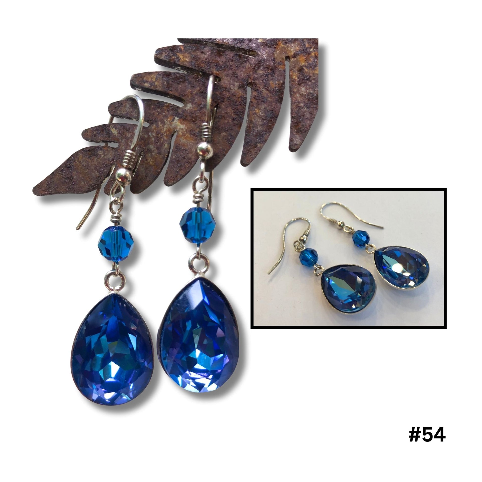 Meridian blue crystal teardrop earrings with silver accents and ear wires by Diane Davidson