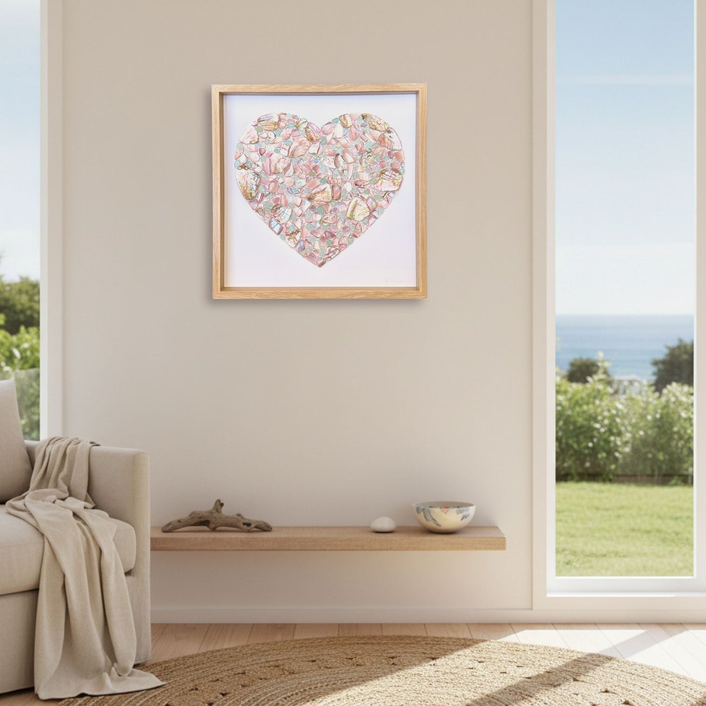Steffi Tregenna A Mermaid's Love shell and sea glass heart artwork hung in a warm coastal New Zealand home interior, Red Peach Gallery Napier
