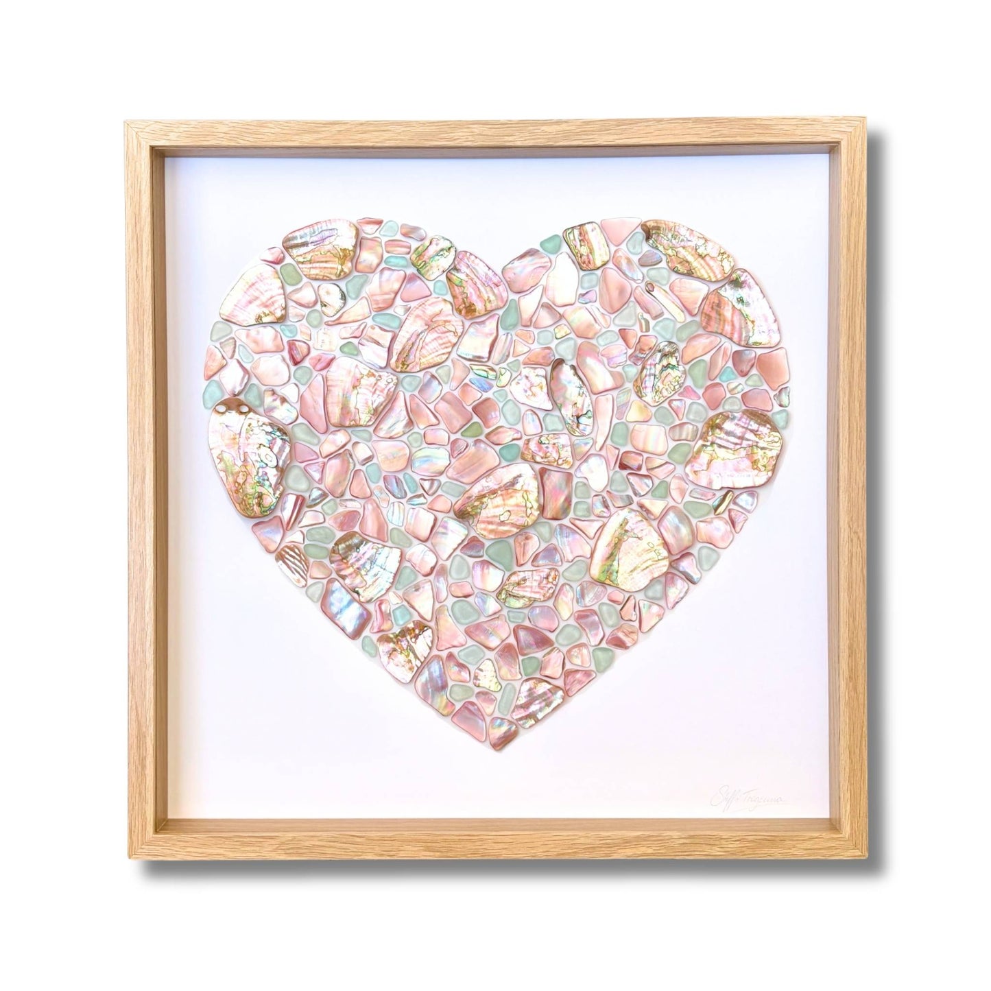 Heart mosaic artwork made from NZ pink mussel shell, pastel blue sea glass and Chilean abalone by artist Steffi Tregenna, framed with glass
