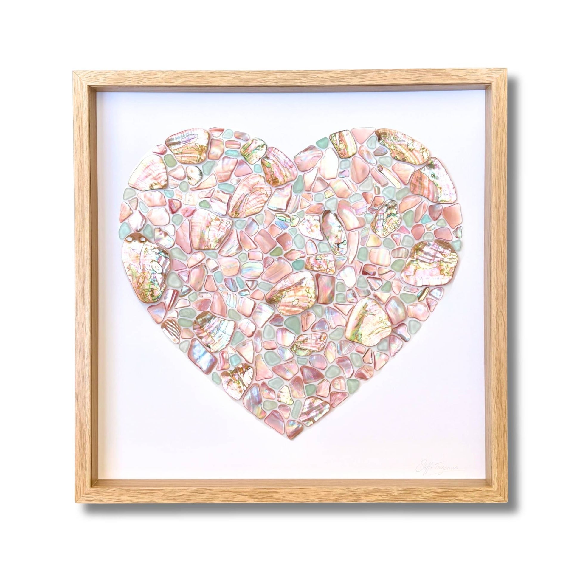 Heart mosaic artwork made from NZ pink mussel shell, pastel blue sea glass and Chilean abalone by artist Steffi Tregenna, framed with glass
