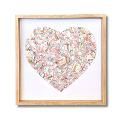 Heart mosaic artwork made from NZ pink mussel shell, pastel blue sea glass and Chilean abalone by artist Steffi Tregenna, framed with glass
