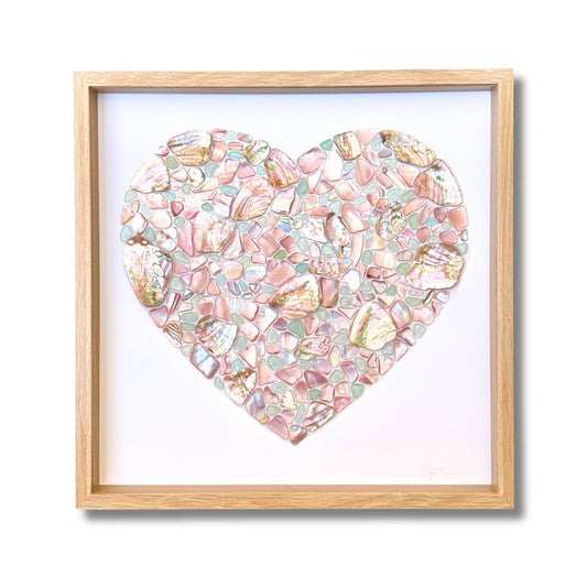 Heart mosaic artwork made from NZ pink mussel shell, pastel blue sea glass and Chilean abalone by artist Steffi Tregenna, framed with glass
