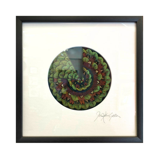 Mini GE Mandala I – round mandala artwork made from pheasant, peacock, and fowl feathers by Fiona Kerr Gedson, framed on white mount.