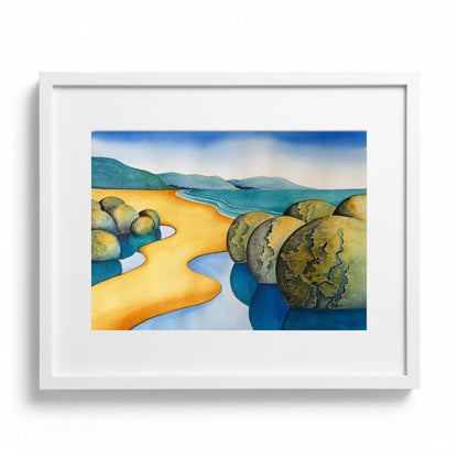 Moeraki Magic watercolour painting by Raewyn Harris showing Moeraki Boulders with golden sand and blue tidal pools in white frame