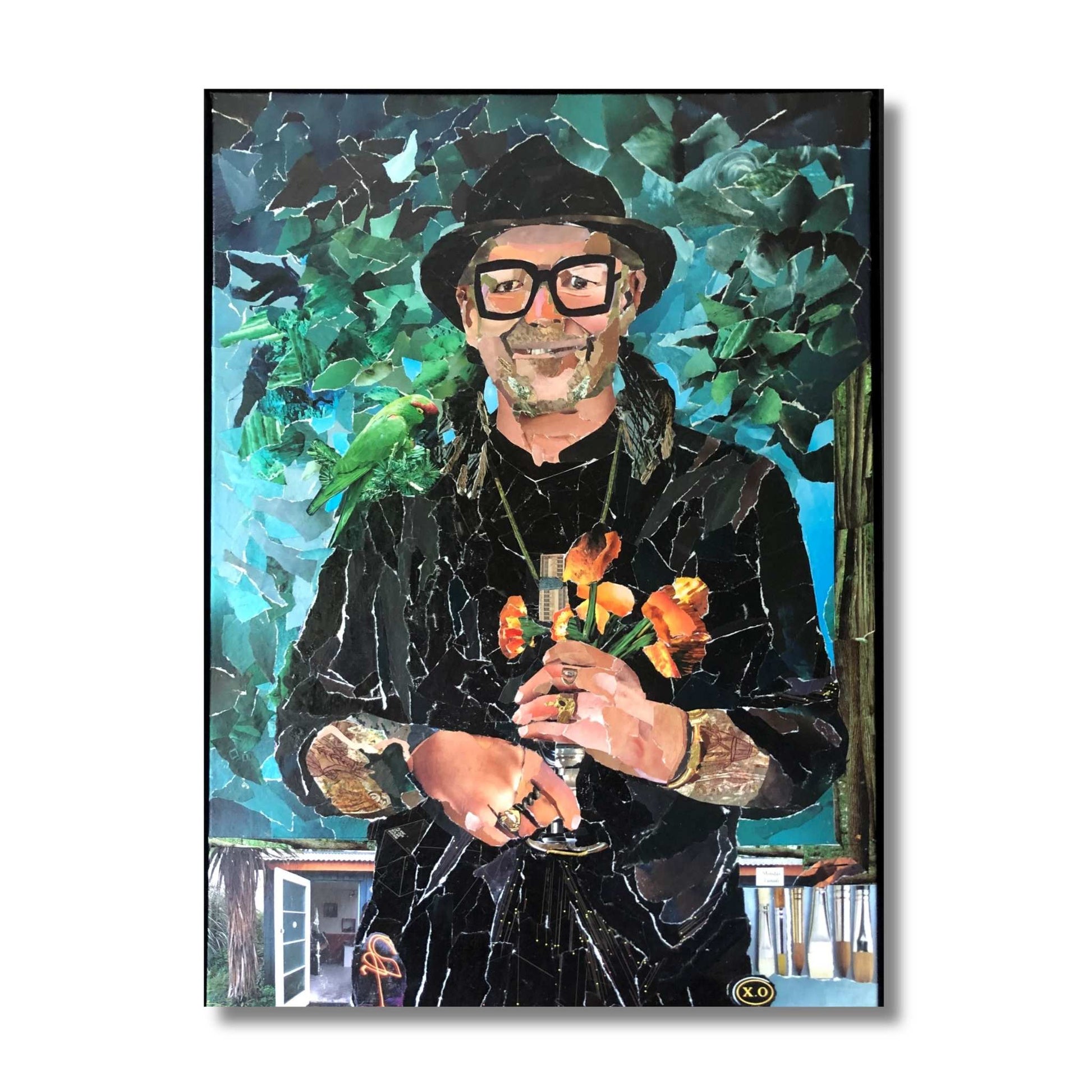 Framed original ripped paper collage portrait of a man in a black hat with a green parrot and orange flowers by Janice Corbishley, 54 x 74cm, titled Monday Painter
