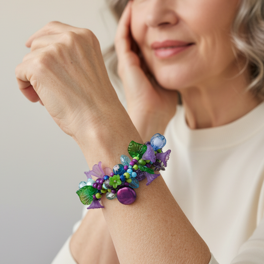 Natural jewelry photography of woman wearing Judith Bradley beaded bracelet with depth of field