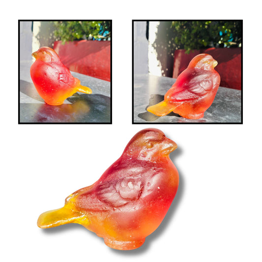 Cast glass bird sculpture in orange and gold by Lou Mathieson, 7x4x5cm, shown on white background
