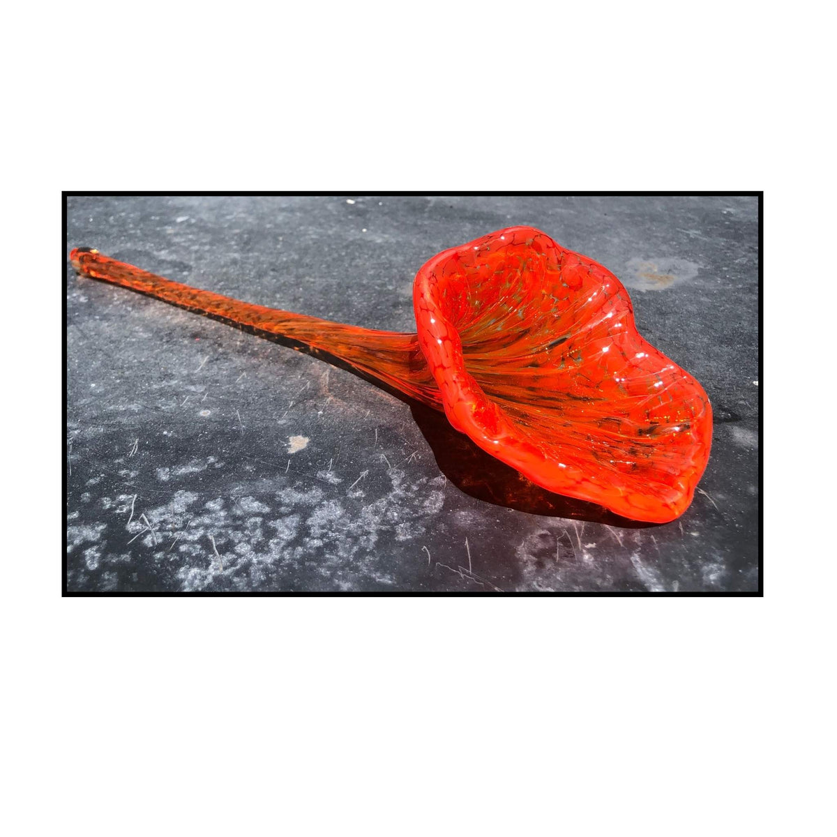 red glass blown flower by Heather Kremen