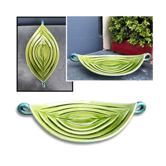Olive green oval ceramic bowl by Tom Sommerville with carved contour lines
