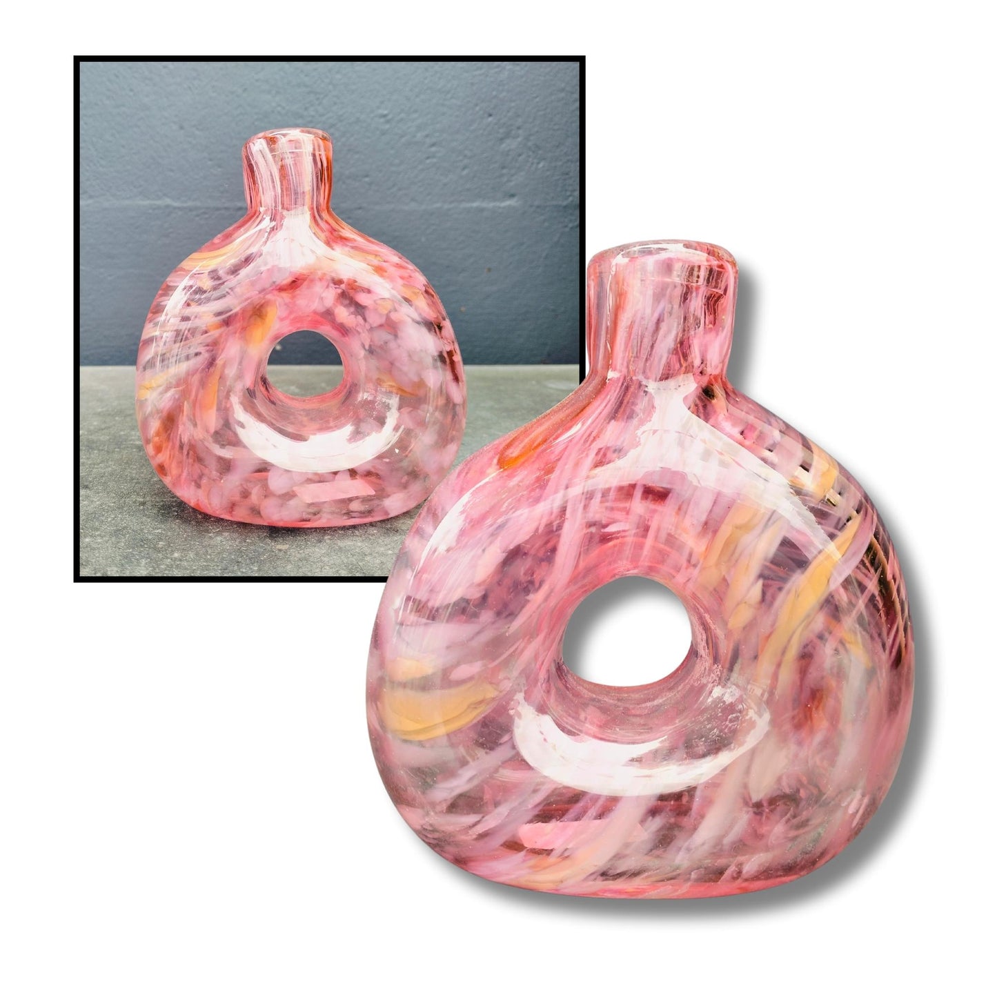 Handcrafted pink donut-shaped glass vase with swirled pink, purple and orange tones and circular opening