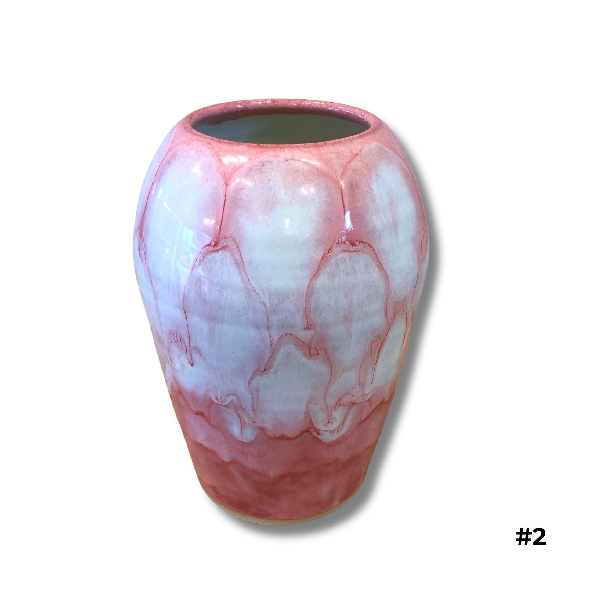 Handmade ceramic vase in pink and lavender glaze by Karene Fairey on white background
