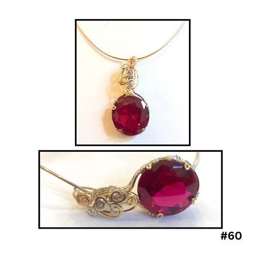  Round ruby crystal pendant with gold-filled wire scrollwork and silver setting on chain by Diane Davidson