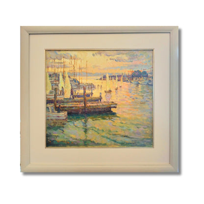 Framed painting by  Brown - End of the Day’s Sailing - Napier, showing sailboats, moorings and textured brushwork in golden, blue and green harbour reflections.
