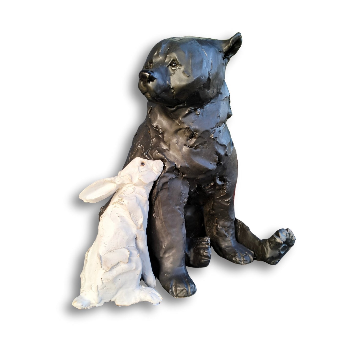 Hand-sculpted ceramic bear and rabbit titled "Secret Crush" by Kylie Matheson – a tender moment captured in clay, full view