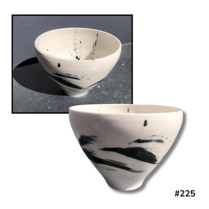 Spatter ceramic bowl by artist Lyn Rigg on white background
