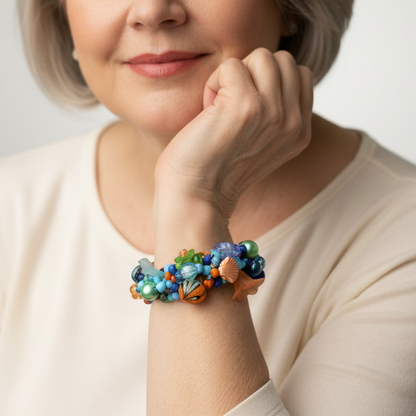 Square jewelry photography of different woman wearing Judith Bradley beaded bracelet