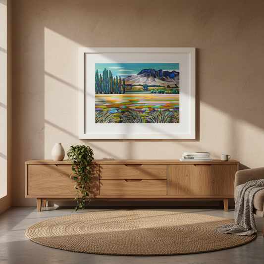 Large framed landscape painting of Te Mata Peak by Helena Verhaaren displayed in a warm contemporary home interior setting.
