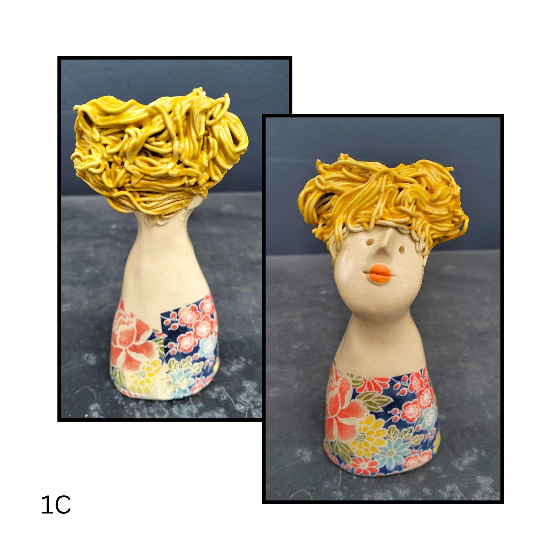 Ceramic figurine in a pale floral outfit, glancing upward with a serene expression and windswept black hair.