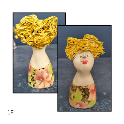Playful ceramic character in soft coral pink,  yellow hair stylishly messy