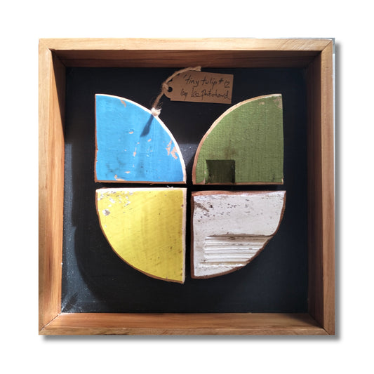 Tiny Tulip, original mixed media artwork by Lee Pritchard, four reclaimed painted beehive wood quarter-circles forming a tulip on navy background
