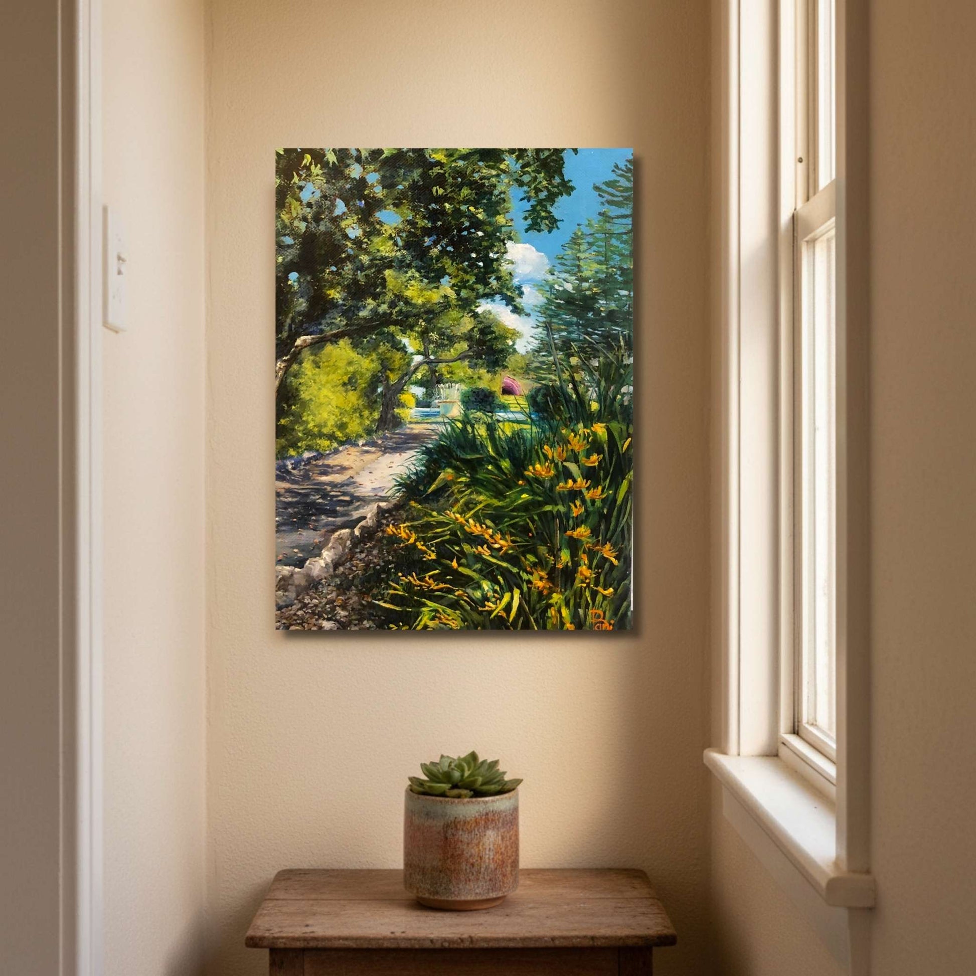 Small portrait oil painting of Napier's Marine Parade gardens by Bari Duncan displayed in a warm intimate home interior setting.
