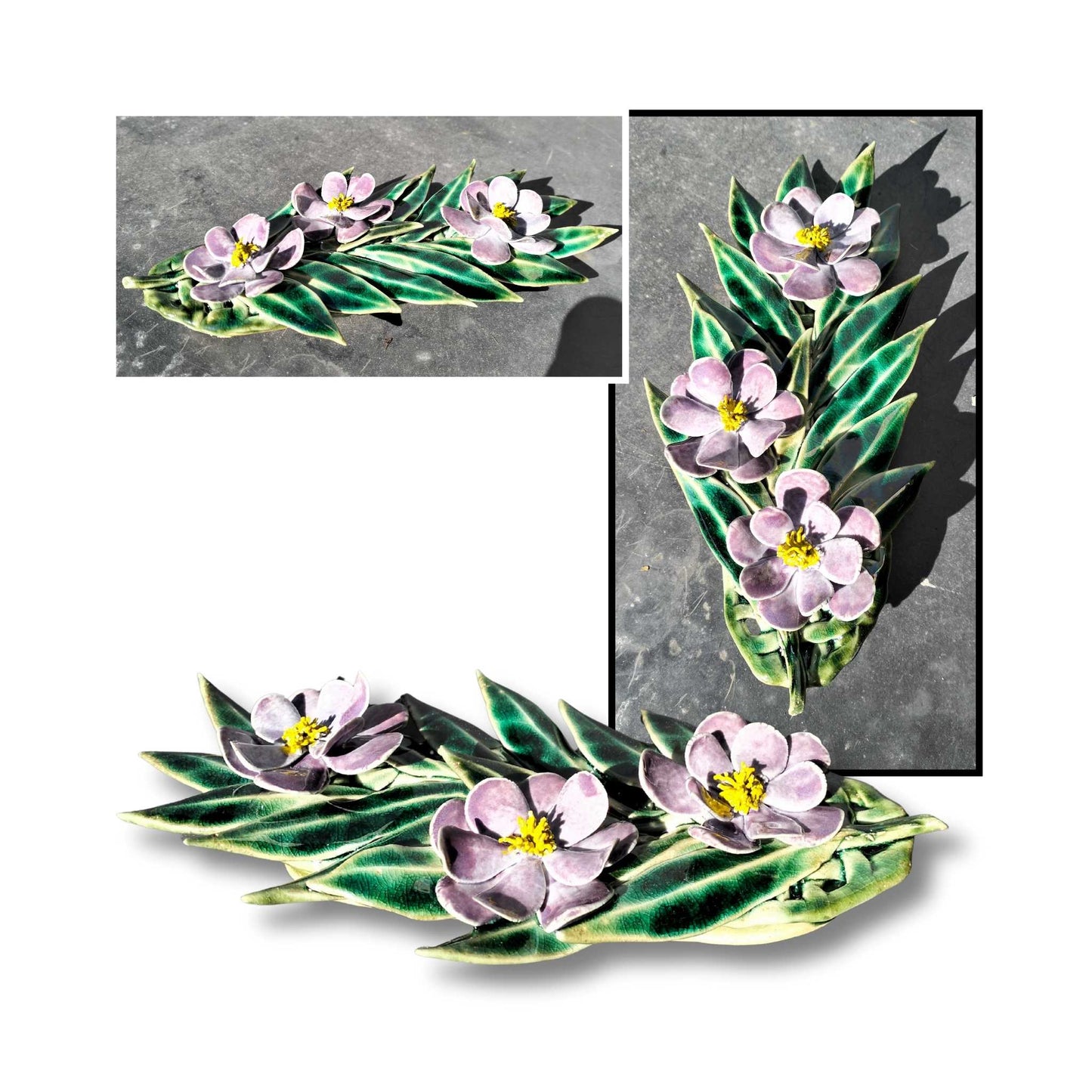 Deep purple ceramic camellia wall art with three flowers and sculpted foliage.