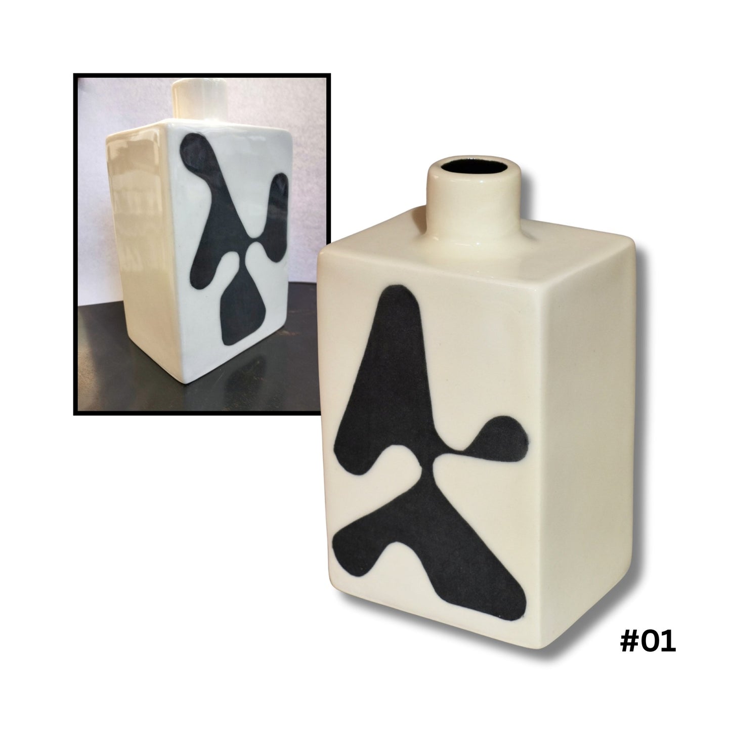 White ceramic bottle vase with bold black abstract design handcrafted by Greg Melville
