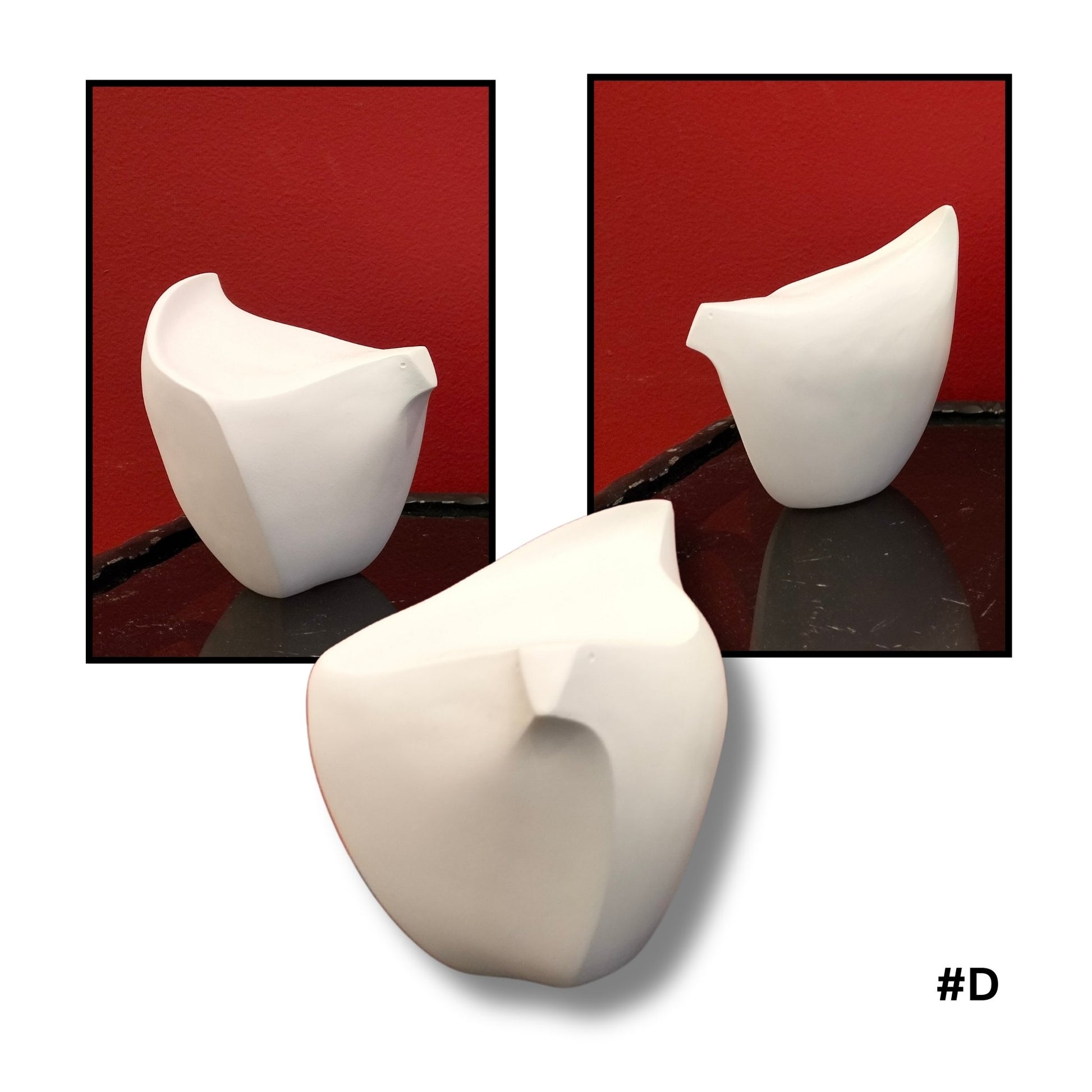 White ceramic bird  sculpture #D on a reflective surface with a red background