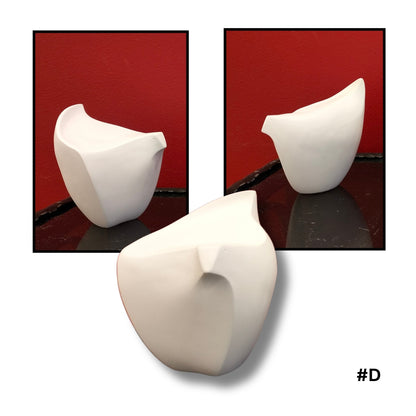 White ceramic bird  sculpture #D on a reflective surface with a red background