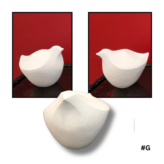 White Earthenware ceramic bird no.G sculpture on a red background
