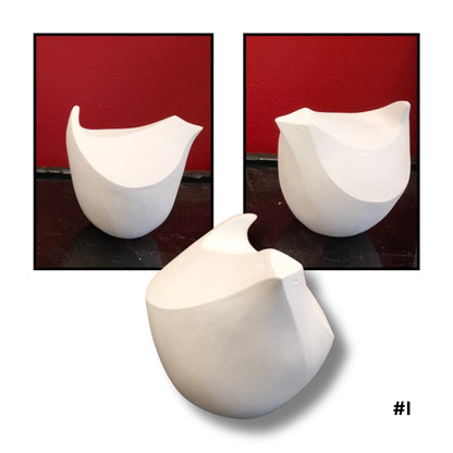 White Earthenware ceramic bird no.I sculpture on a red background