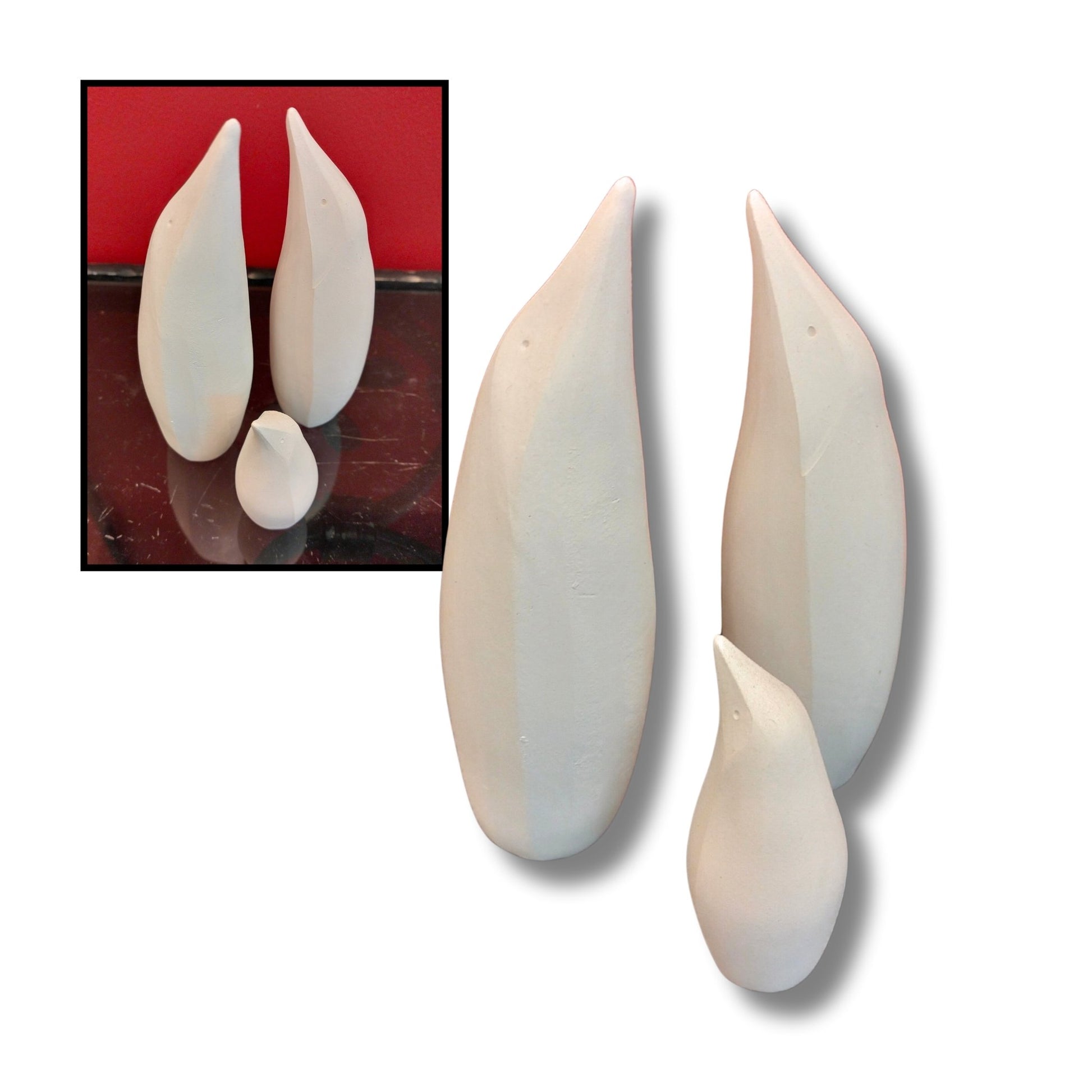 Family set of white ceramic penguin sculptures on a white background with an inset showing them on a red surface.